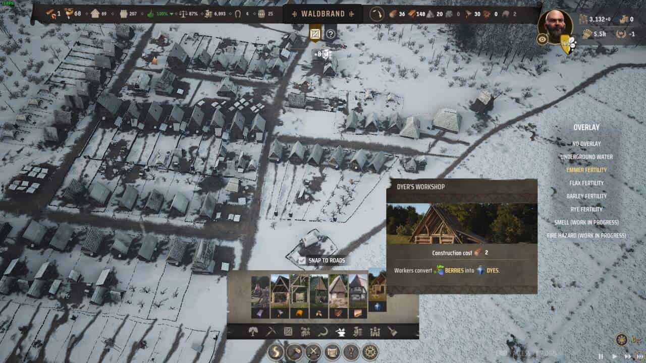 Manor Lords make Clothes: Dyer's Workshop in building menu with aerial view of a town in the background.