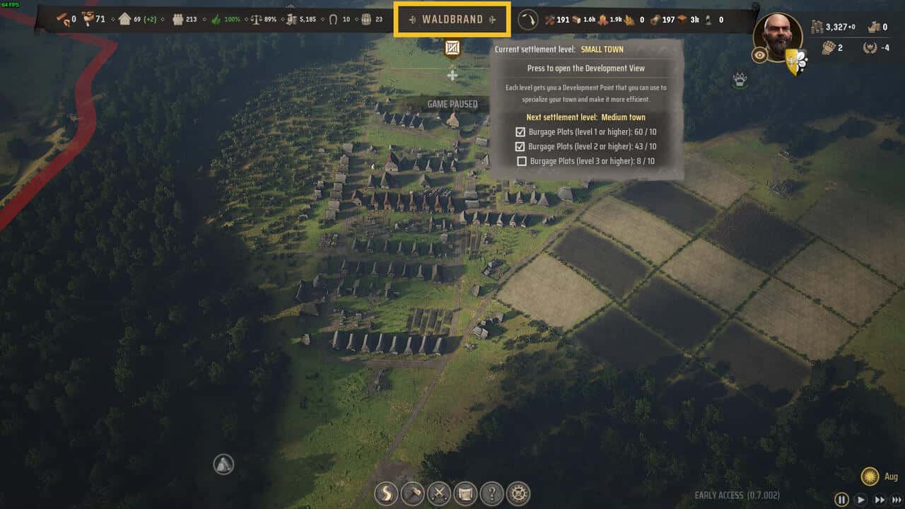 Manor Lords Settlement Level: aerial view of a medieval village with it's name highlighted at the top of the screen in yellow.
