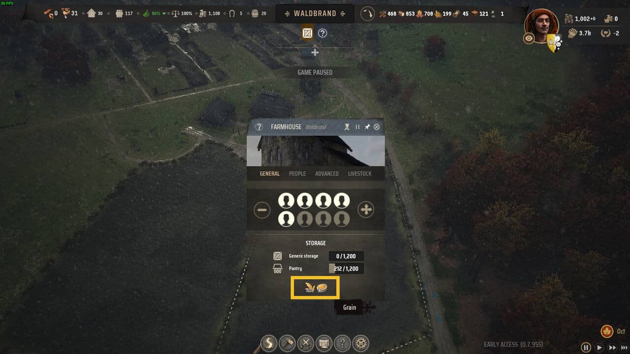 Manor Lords windmill not working: aerial view of a medieval village with the farmhouse overlay selected.