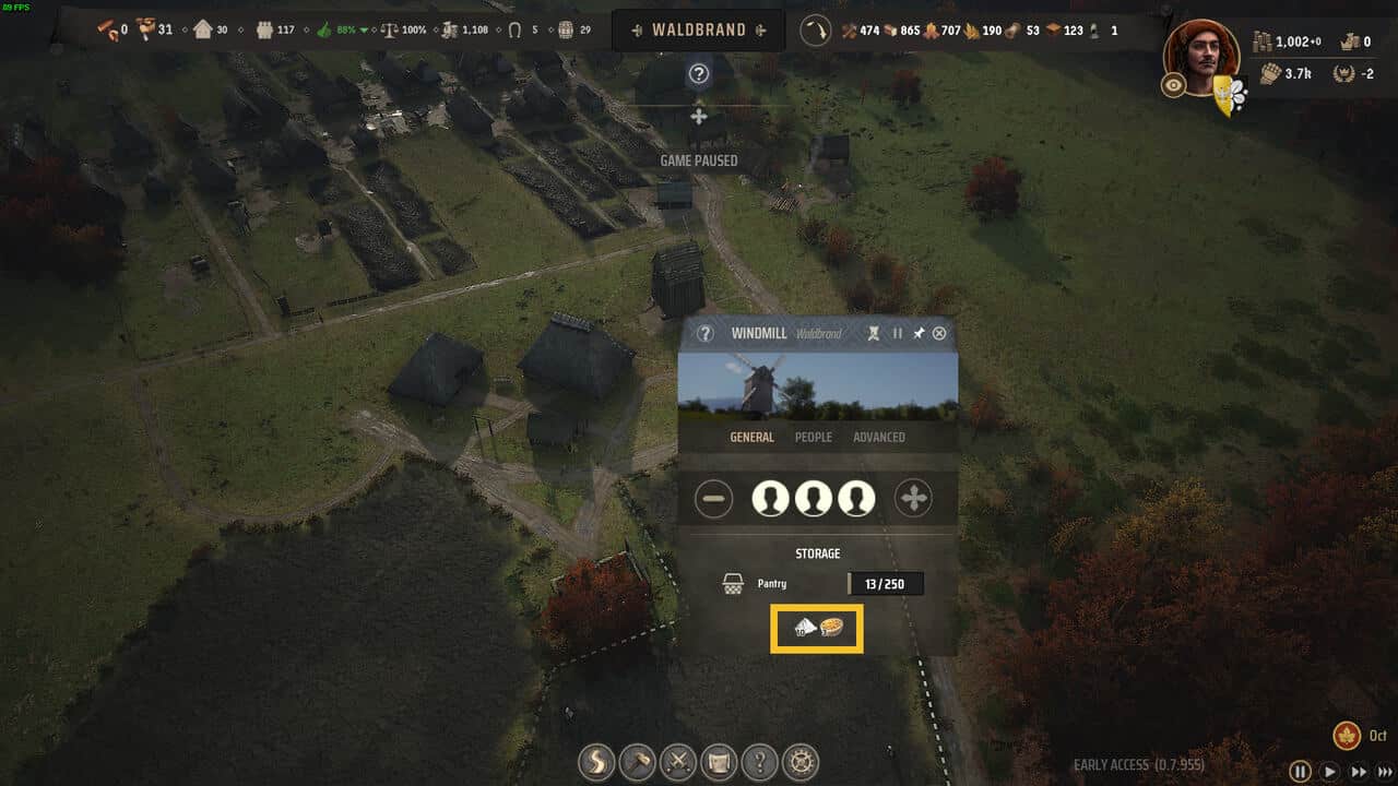 Manor Lords windmill not working: aerial view of a medieval village with the windmill overlay selected.