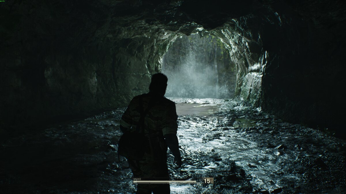 Metal Gear Solid Delta: Snake Eater review: Snake near a waterfall.