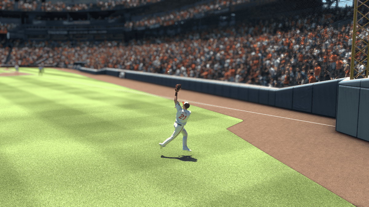 A baseball player is throwing a ball in a stadium, showcasing their skills.