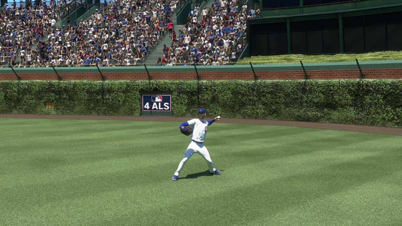 Baseball player fielding in the outfield in front of a crowded stadium, showcasing "MLB The Show 24".