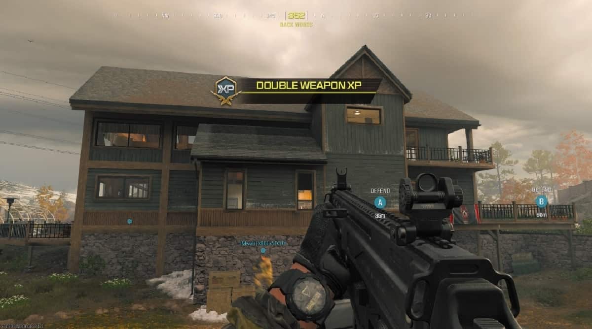A screenshot of a house with a gun in front of it during the MW3 Double XP Weekend.