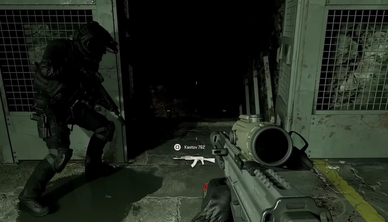 A man is brandishing a gun in front of a door, reminiscent of MW3 editions.