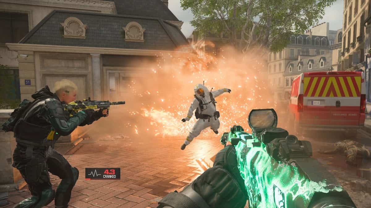 Two armed soldiers engage in a firefight against an opponent.