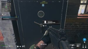 MW3 Zombies Hostile Takeover: A player stands next to a safe in the game.