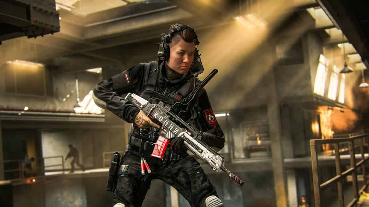A person in tactical gear holding an assault rifle in the game.