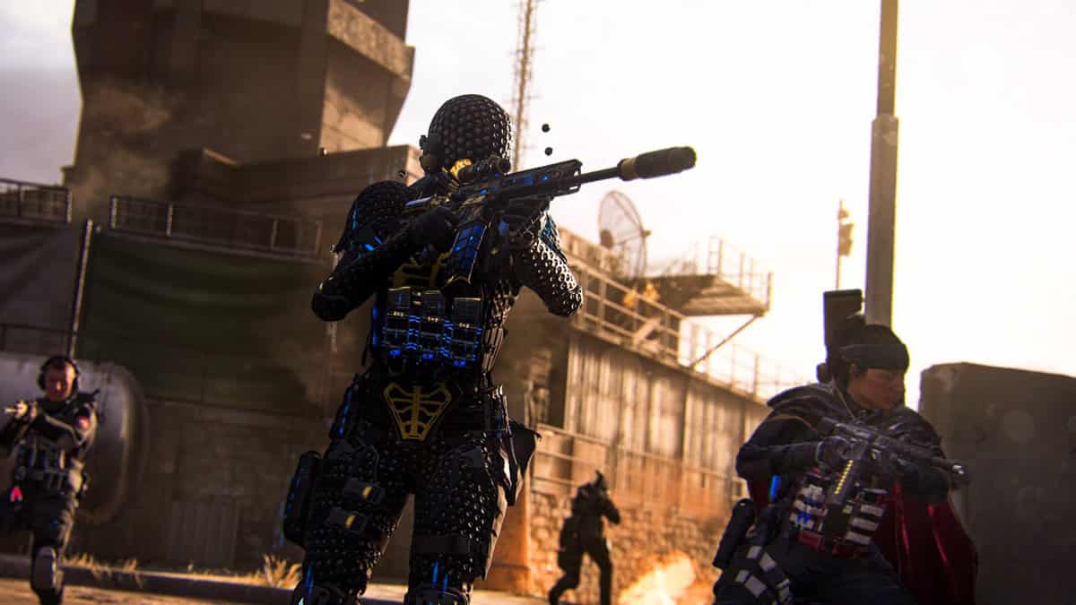 A heavily armed operator with a futuristic suit of armor.