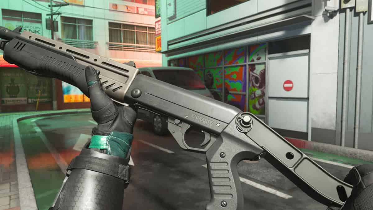 A person holding a shotgun from the game.