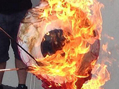 Neversoft staff wave goodbye to studio by setting fire to a huge eyeball