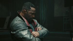 Cyberpunk 2077 Phantom Liberty review - A man in a leather jacket is standing next to another man in Night City.