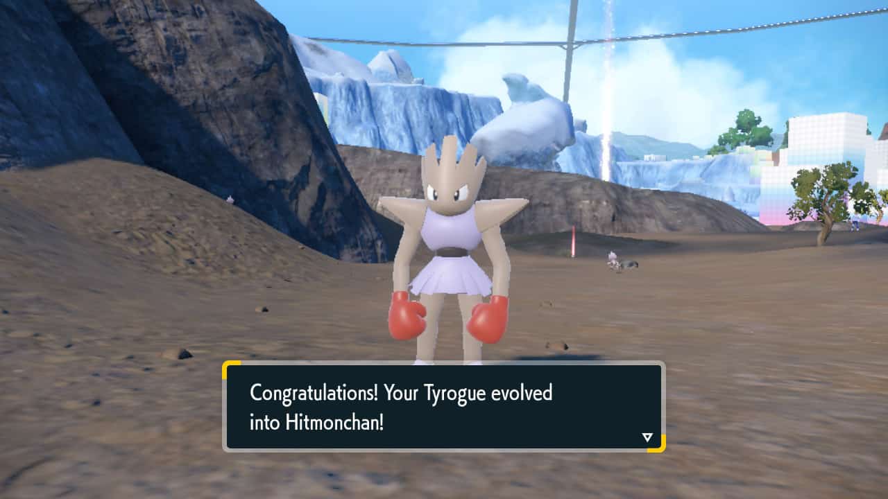 Pokemon Indigo Disk how to evolve Tyrogue: Hitmonchan standing in a mountain area