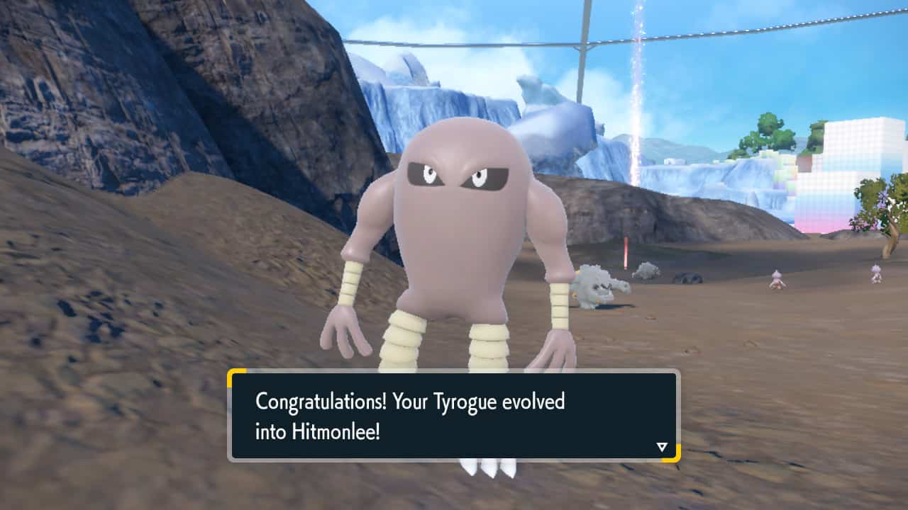 Pokemon Indigo Disk how to evolve Tyrogue: Hitmonlee standing in a mountain area