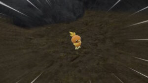 An image of a small yellow Torchic Pokémon in a cave.