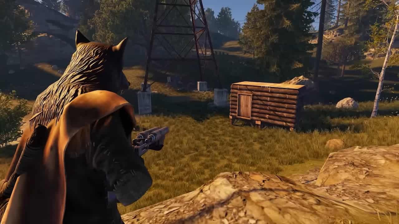 A Rust player looks at a wooden shack in the woods