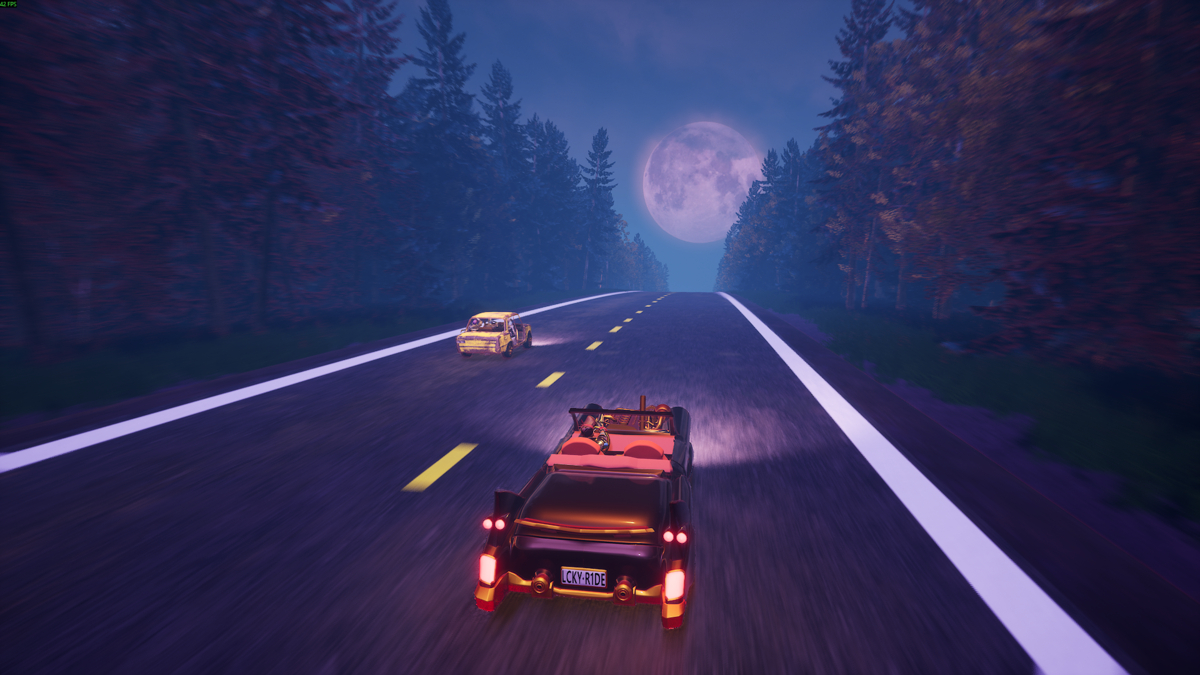 Scaravan 66: cars driving on a tree-lined highway at night.