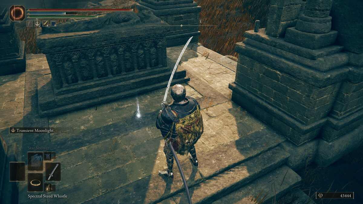 Shadow of the Erdtree Backhand Blade: A player standing next to an item drop and a tomb.