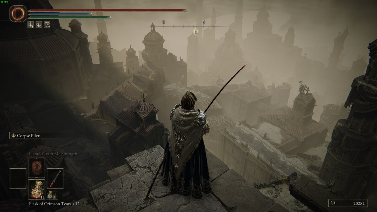 Elden Ring Shadow of the Erdtree review: Tarnished standing above the Belurat legacy dungeon.