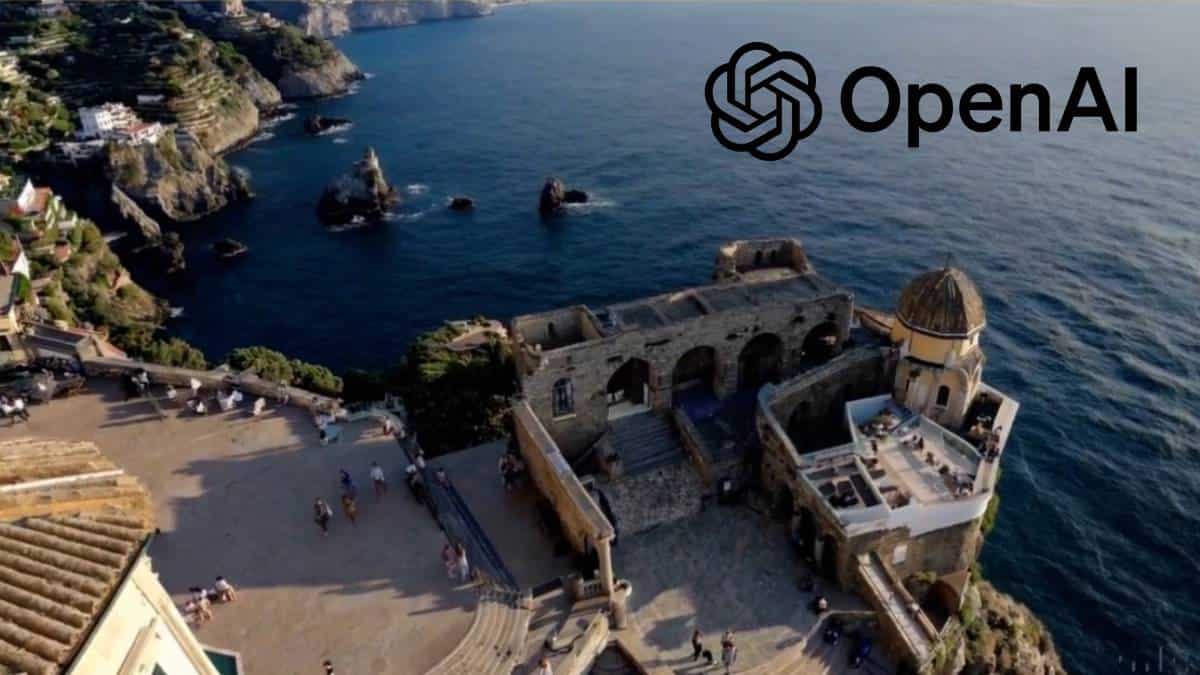 An aerial view of an open ai building with the ocean in the background, providing access to Sora.