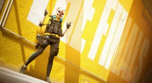 The Finals release date - screenshot shows a character standing in front of a yellow wall.
