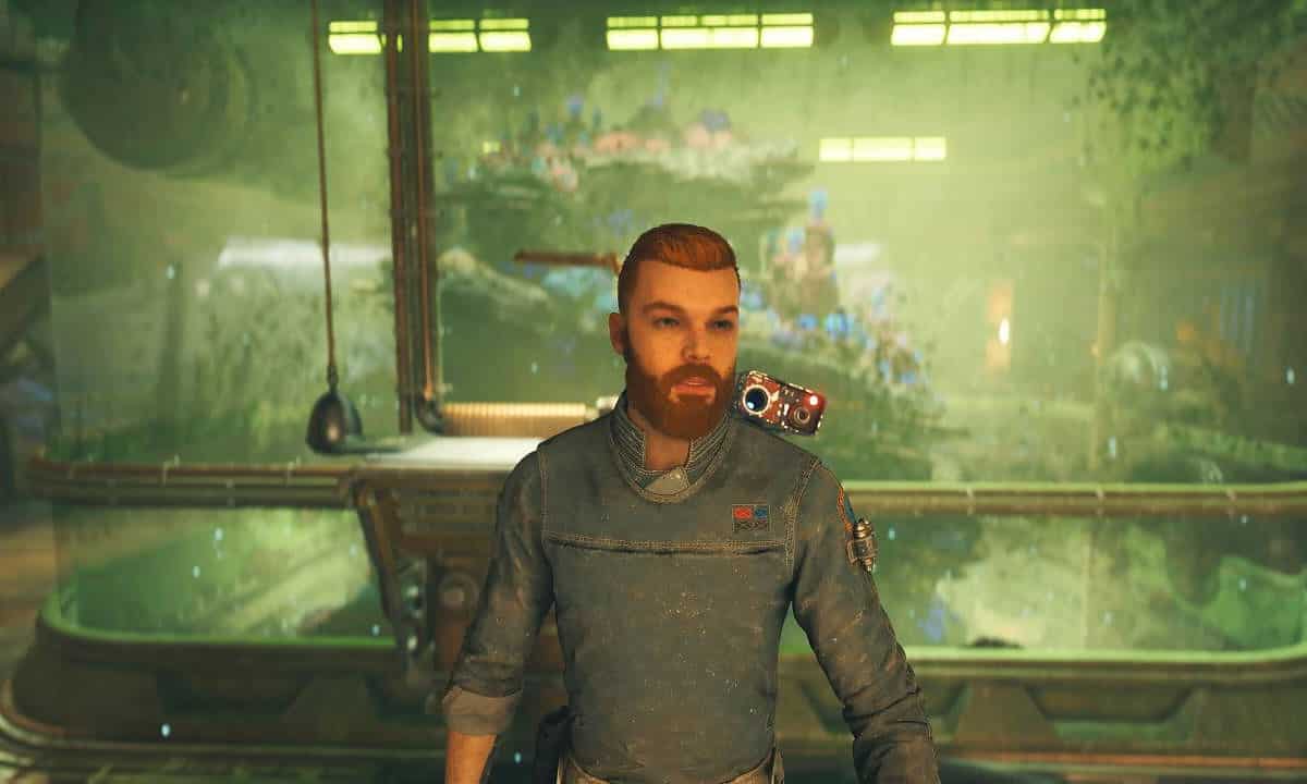 How to clean the fish tank in Jedi Survivor: Cal stood in front of a dirty fish tank with BD-1 on his shoulder.