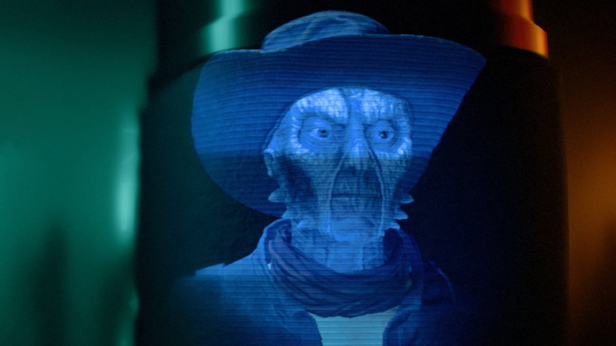Image of a holographic projection of Quint, an Expert in Star Wars Outlaws.