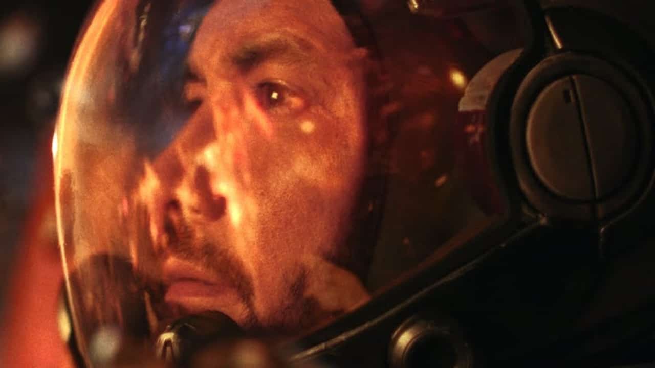 A man in a space suit admiring his reflection in the starfield live action trailer.