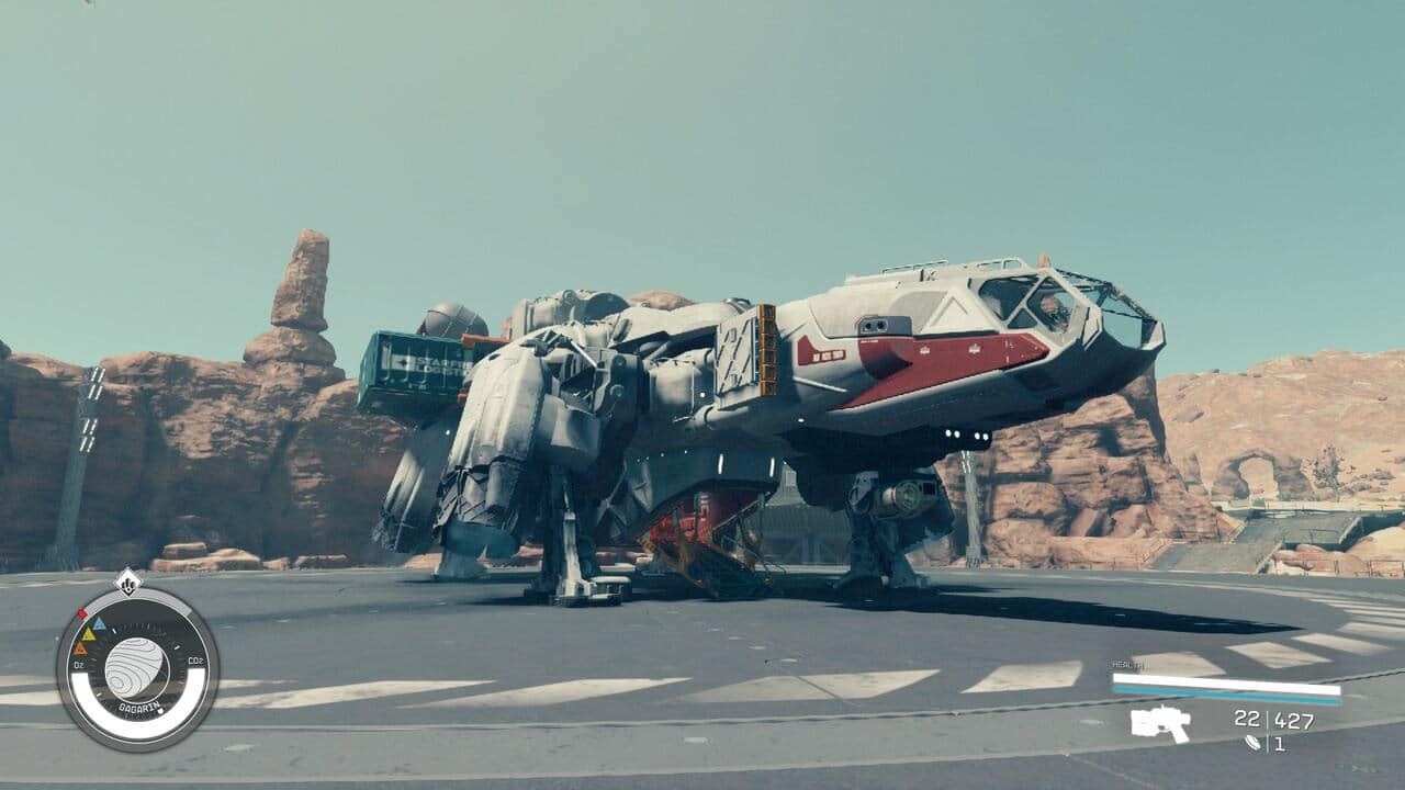 When is the next Starfield update: The Frontier sitting on a landing pad with rocky cliffs in the background.