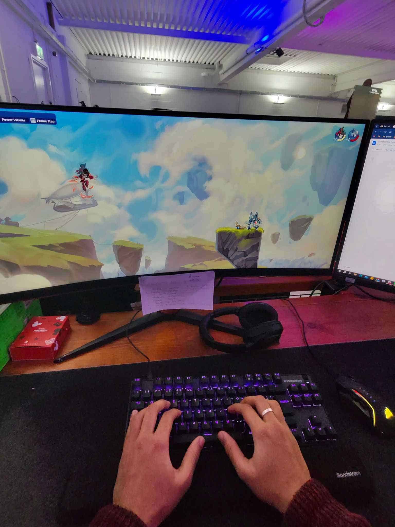 This is a Steelseries Apex 9 TKL review where a person is playing a video game on a computer.