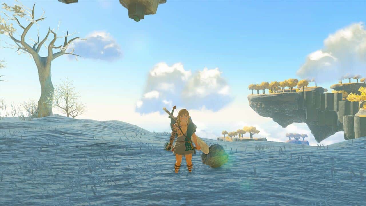 How to unfuse in Tears of the Kingdom: Link stood in the snow shivering with a Rock Shield on his back.