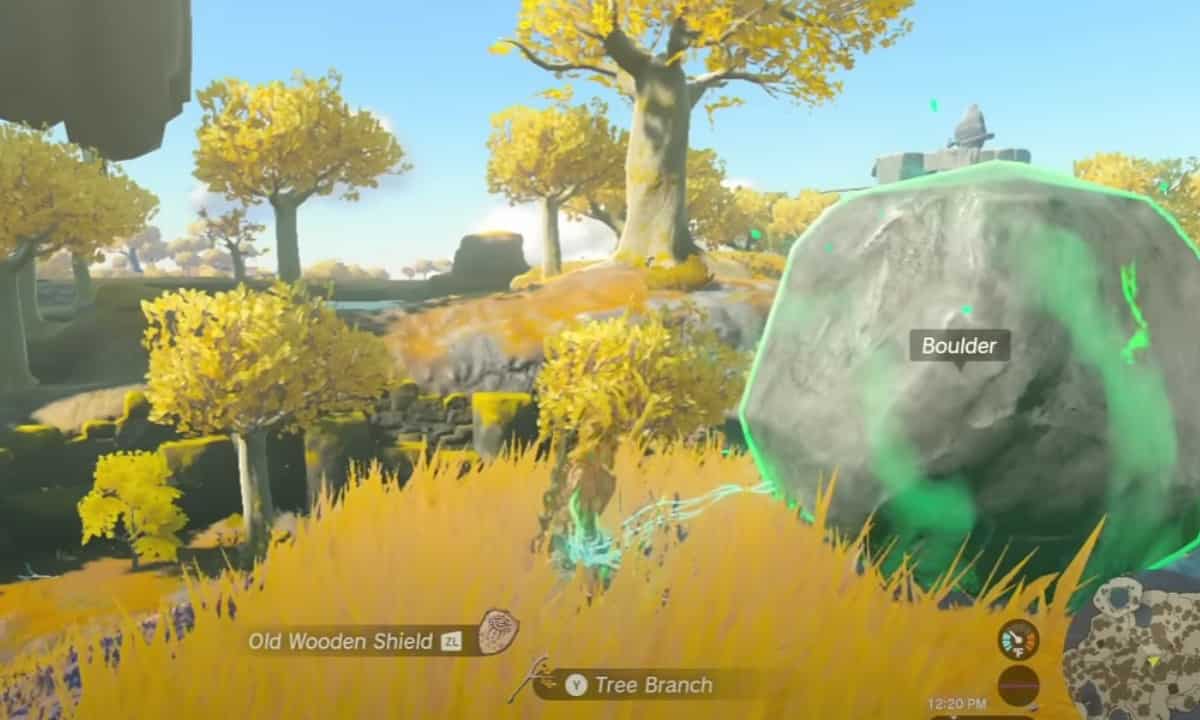 How to make a hammer in Tears of the Kingdom: Link using Ultrahand to fuse tree branch with boulder. 
