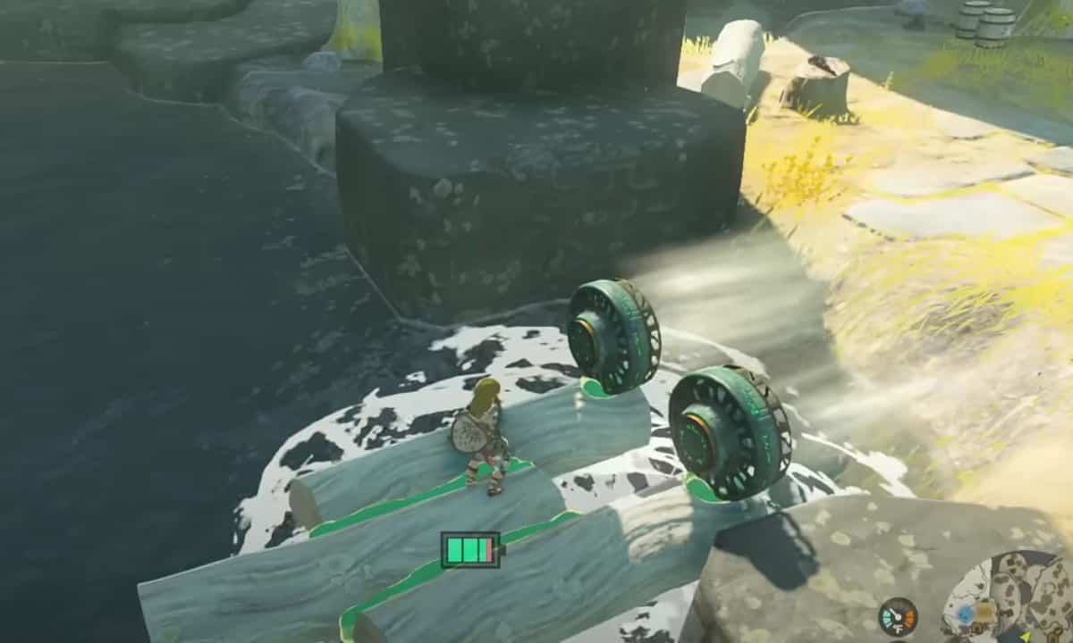 How to make a Tears of the Kingdom raft: Link riding a raft with fans on it. 