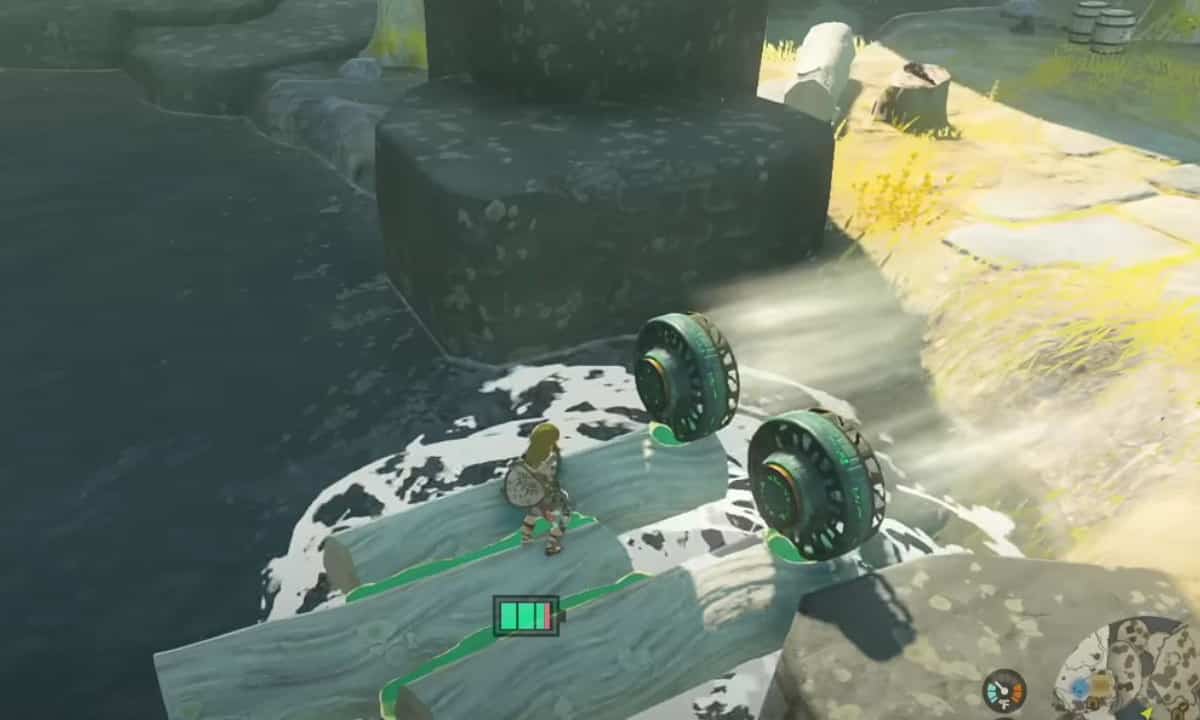 How to make a Tears of the Kingdom raft: Link riding a raft with fans on it.