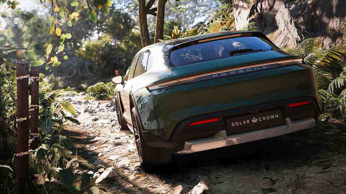 A Porsche driving through a forested area.