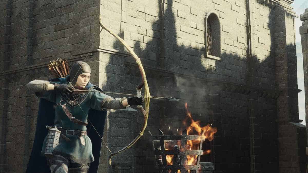 An archer in medieval attire aiming one of the best bows near a stone structure with a flaming brazier in the foreground, reminiscent of Dragon's Dogma 2.