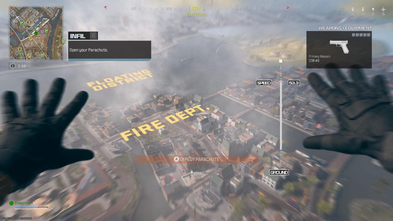 First-person view of a player skydiving into an urban area in a free Warzone Mobile video game, with on-screen hud elements displaying game information.