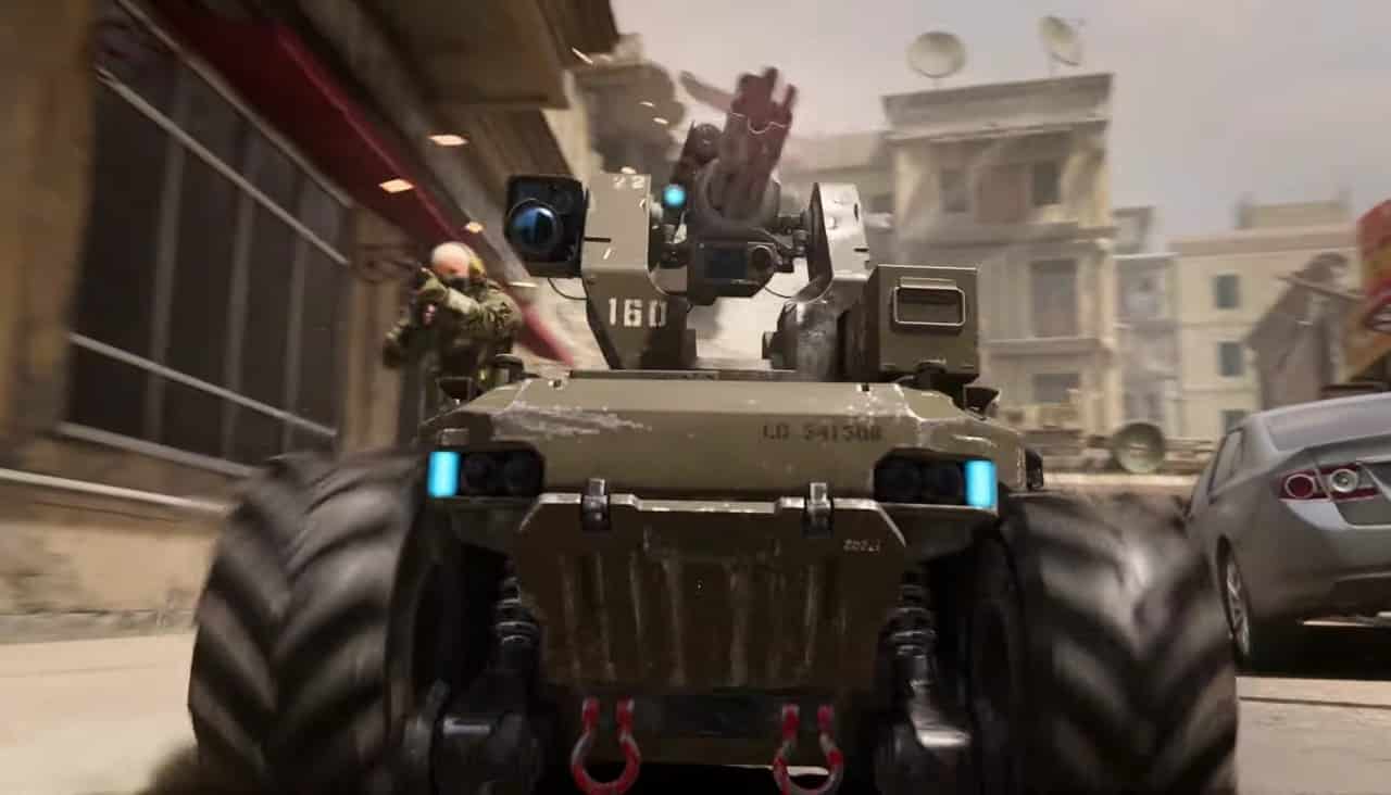 An armored vehicle is driving down a city street during MW3 beta testing.