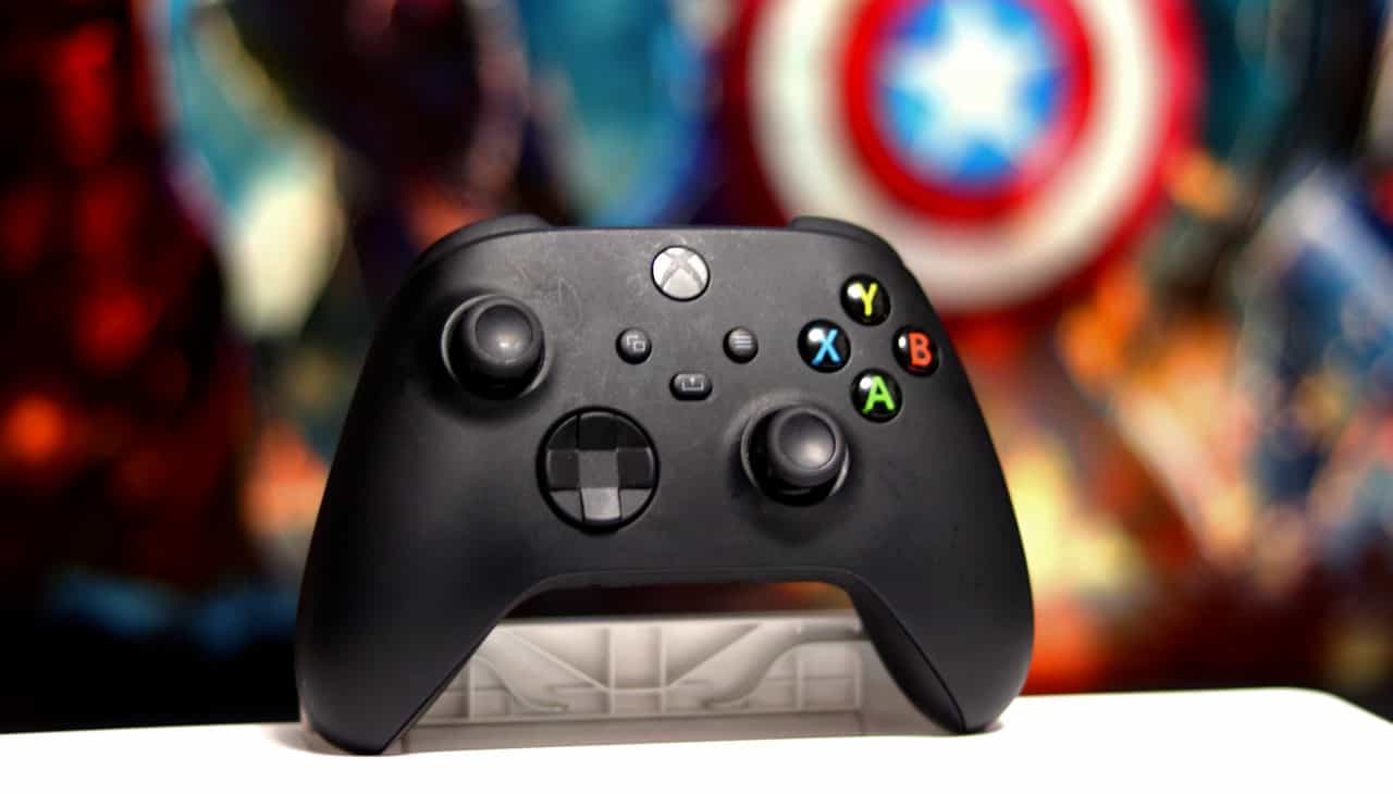 A black Xbox controller sits on a table, still worth buying in 2024?
