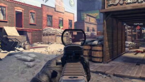 A first-person view of an XDefiant character aiming a gun at a dusty street in an Old West-themed setting, with wooden buildings and various objects.