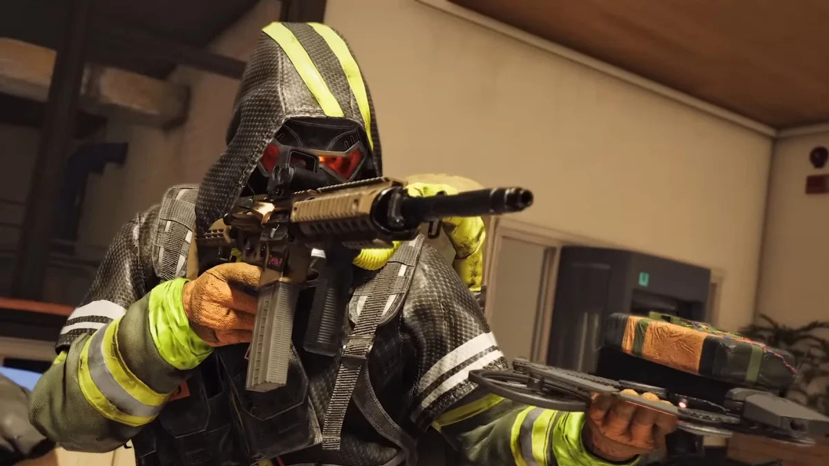 XDefiant player aiming with assault rifle in one hand and holding a drone in the other