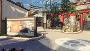 A game screen showing an in-game zoo environment with a countdown timer and objective: "GET INTO POSITION". The area, part of the xDefiant map collection, features animal-themed decorations and signage, and is labeled "ASIA".