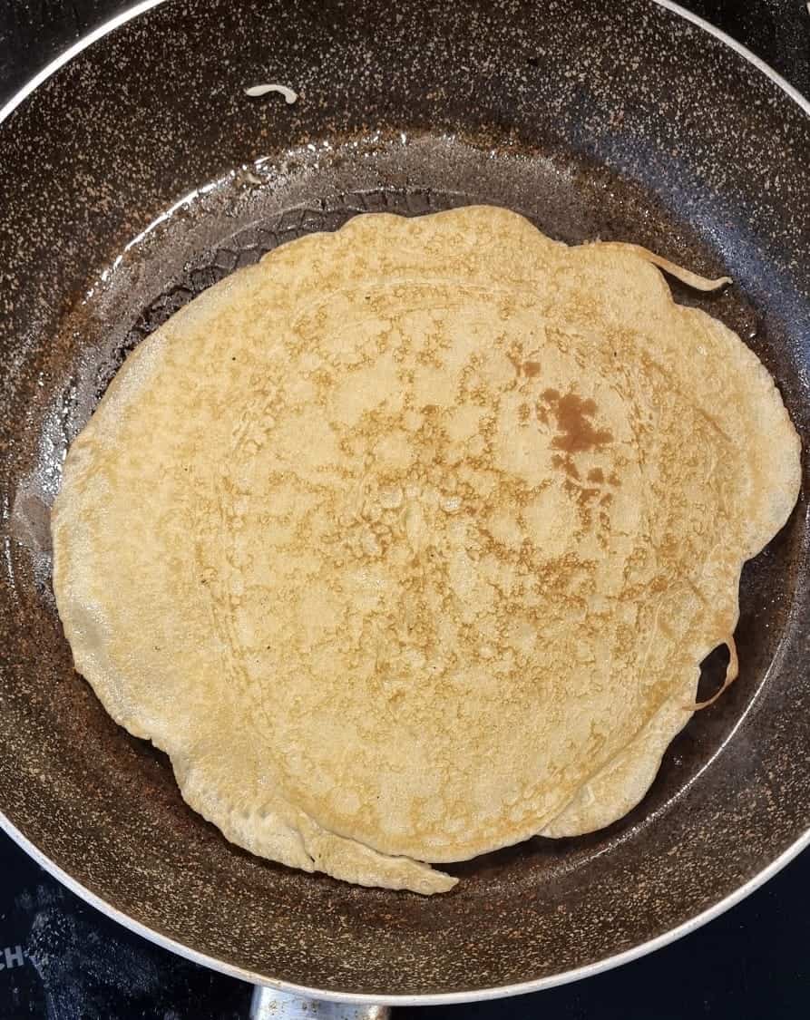 A crepe in a pan.